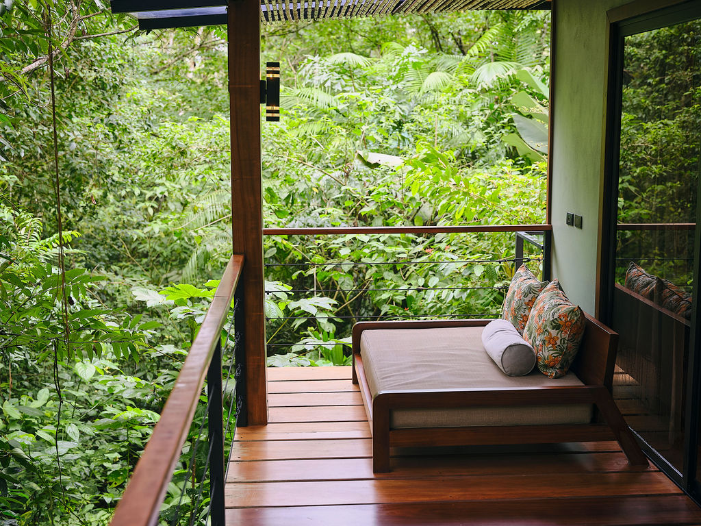 Daybed on a bungalow deck above the rainforest