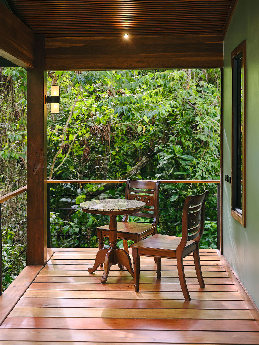 Deck table of the Bungalow Luxury King looking into the rainforest