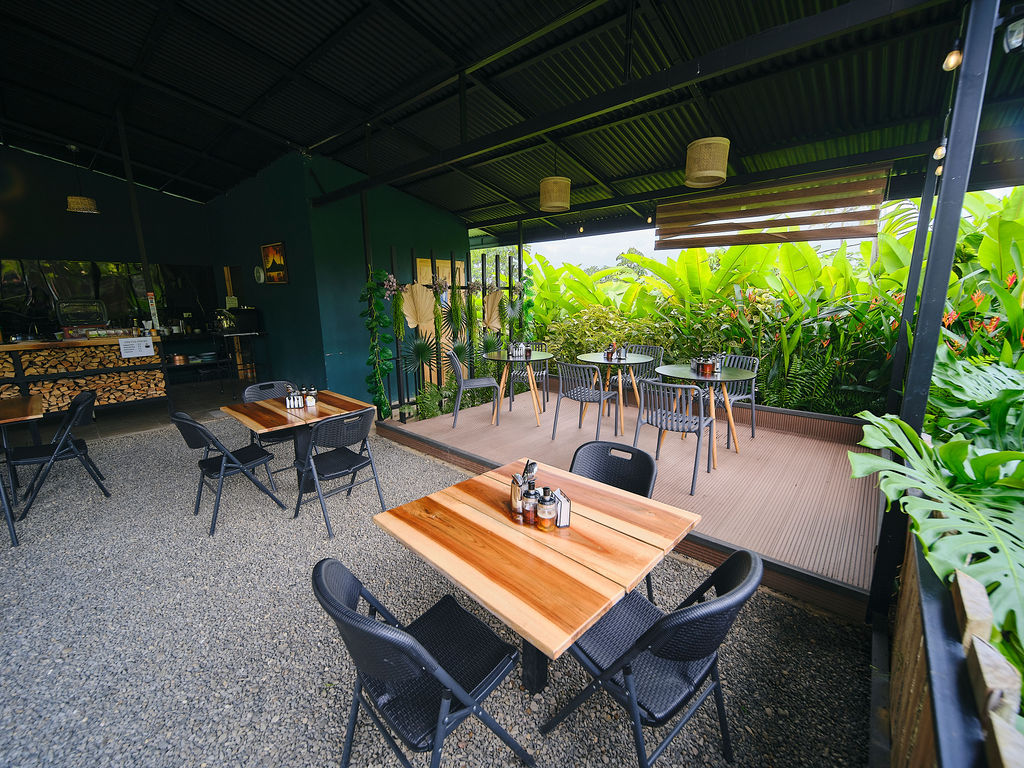 Restaurant tables on the deck with garden views