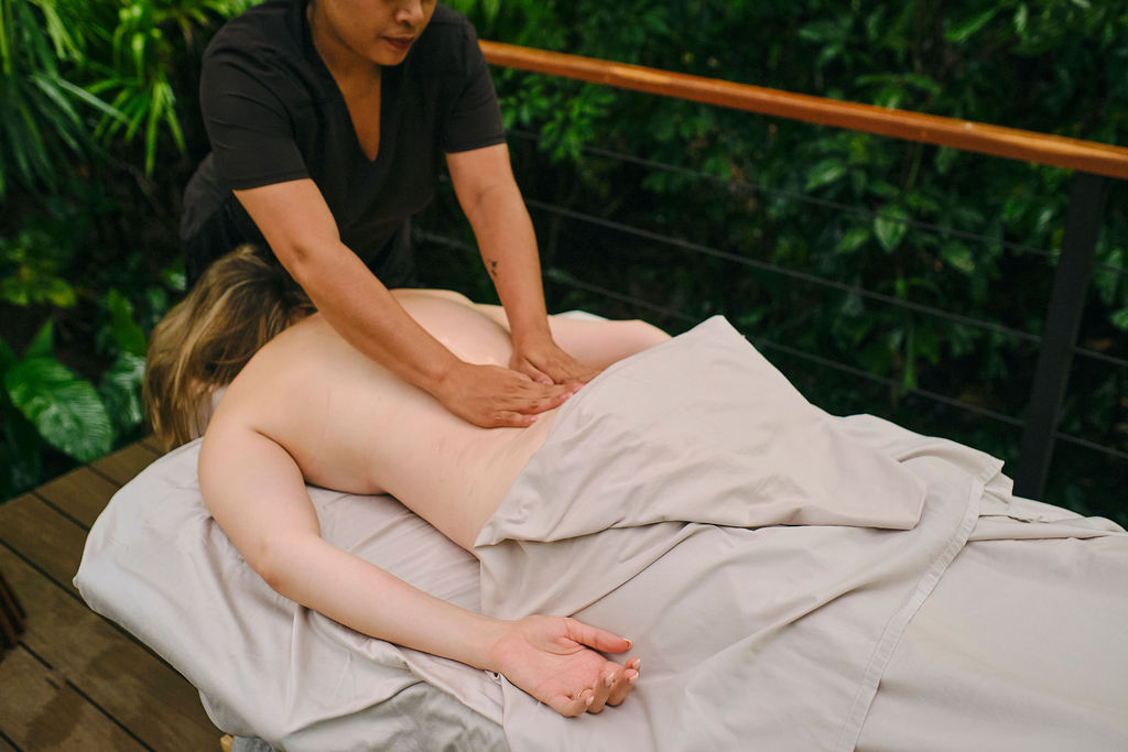 Back massage on a forest deck