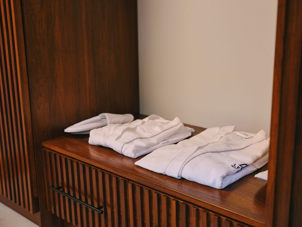 Folded robes on the wardrobe shelf